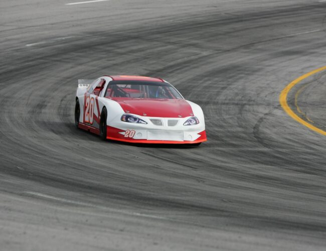 A stock car racing around the track