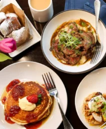 Delicious breakfast spread with pancakes, steak, and pastries at Dunhill Hotel, Charlotte.
