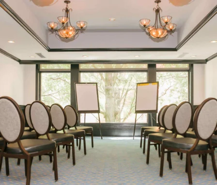 Elegant meeting room with chairs and flipcharts at The Dunhill Hotel, Charlotte.