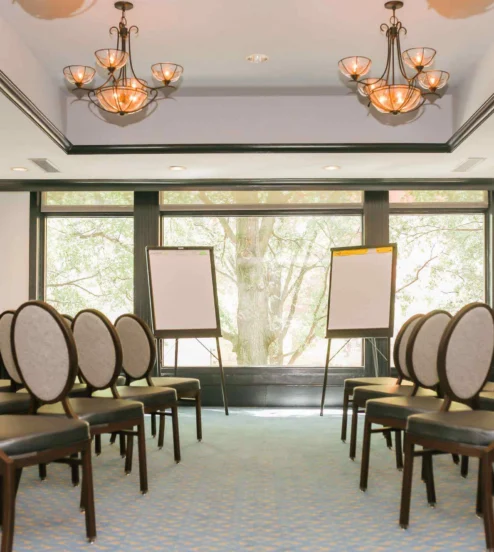 Elegant meeting room with chairs and flipcharts at The Dunhill Hotel, Charlotte.