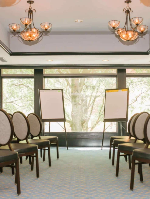 Elegant meeting room with chairs and flipcharts at The Dunhill Hotel, Charlotte.
