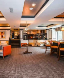 Elegant lobby of The Dunhill Hotel, with cosy seating and a welcoming bar.