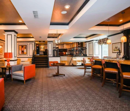 Elegant lobby of The Dunhill Hotel, with cosy seating and a welcoming bar.