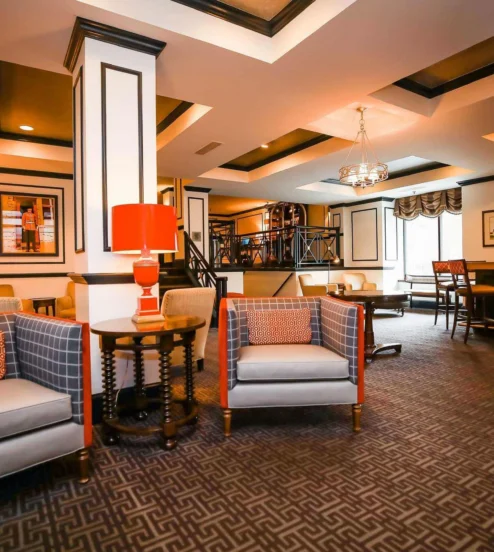 Elegant hotel lounge with cosy seating and a welcoming atmosphere.