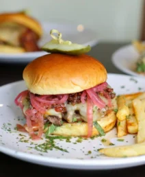 Gourmet burgers and fries served at The Dunhill Hotel restaurant.