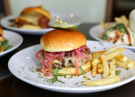 Gourmet burgers and fries served at The Dunhill Hotel restaurant.