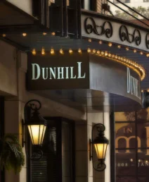 Elegant entrance of The Dunhill Hotel with classic lanterns and inviting signage.