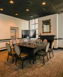 Elegant dining room with a set table at The Dunhill Hotel, Charlotte.
