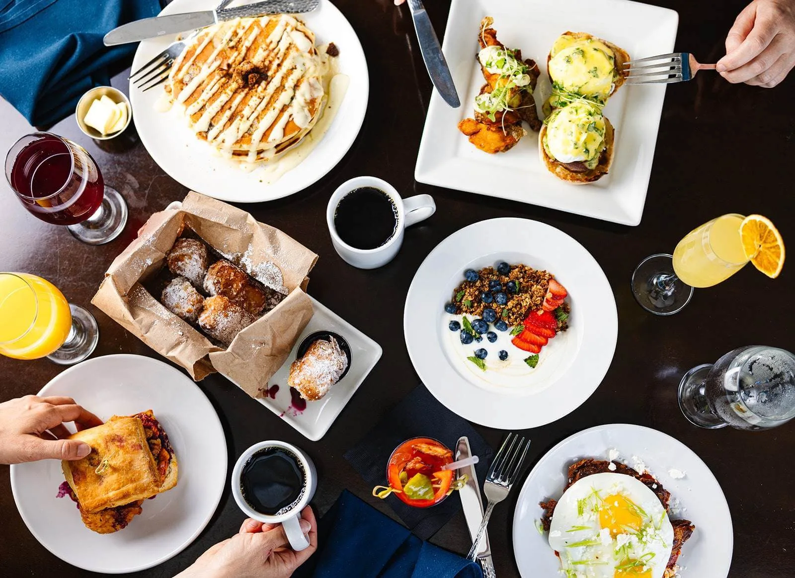 A table set with various breakfast foods and drinks